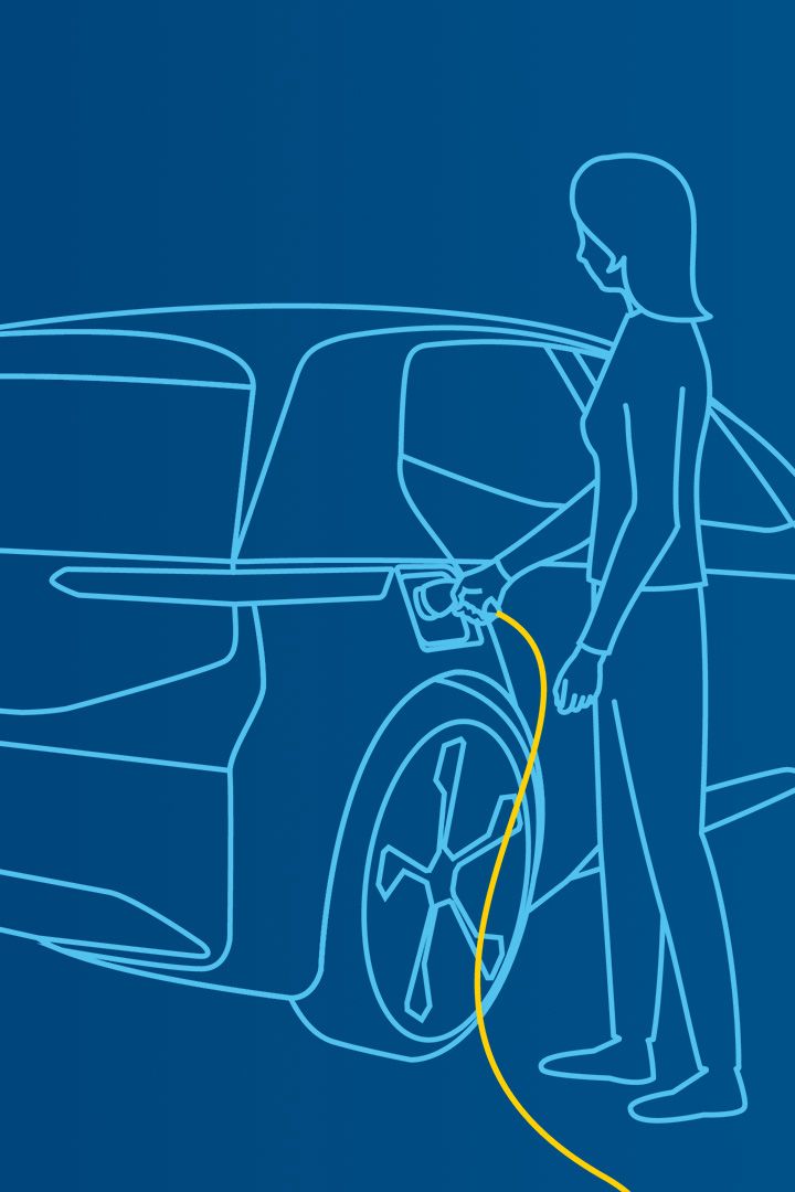 Frau lädt ihr Elektrofahrzeug
